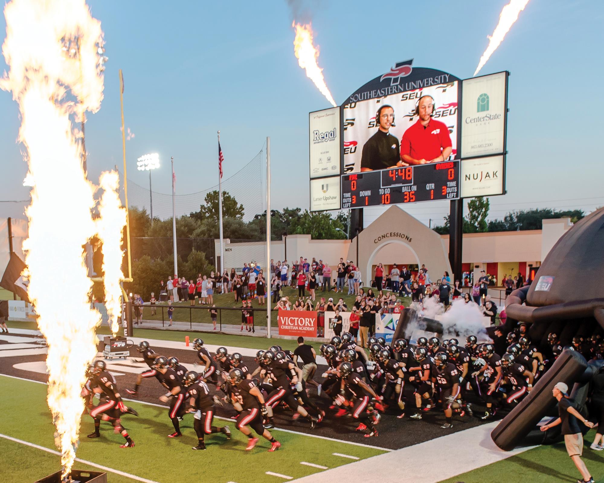 Donnie Smith broadcasting a Southeastern football game (on the scoreboard).